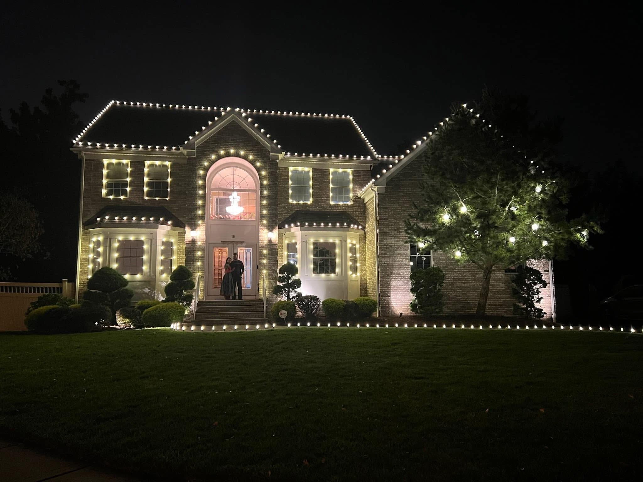 Exterior holiday lighting installation 26